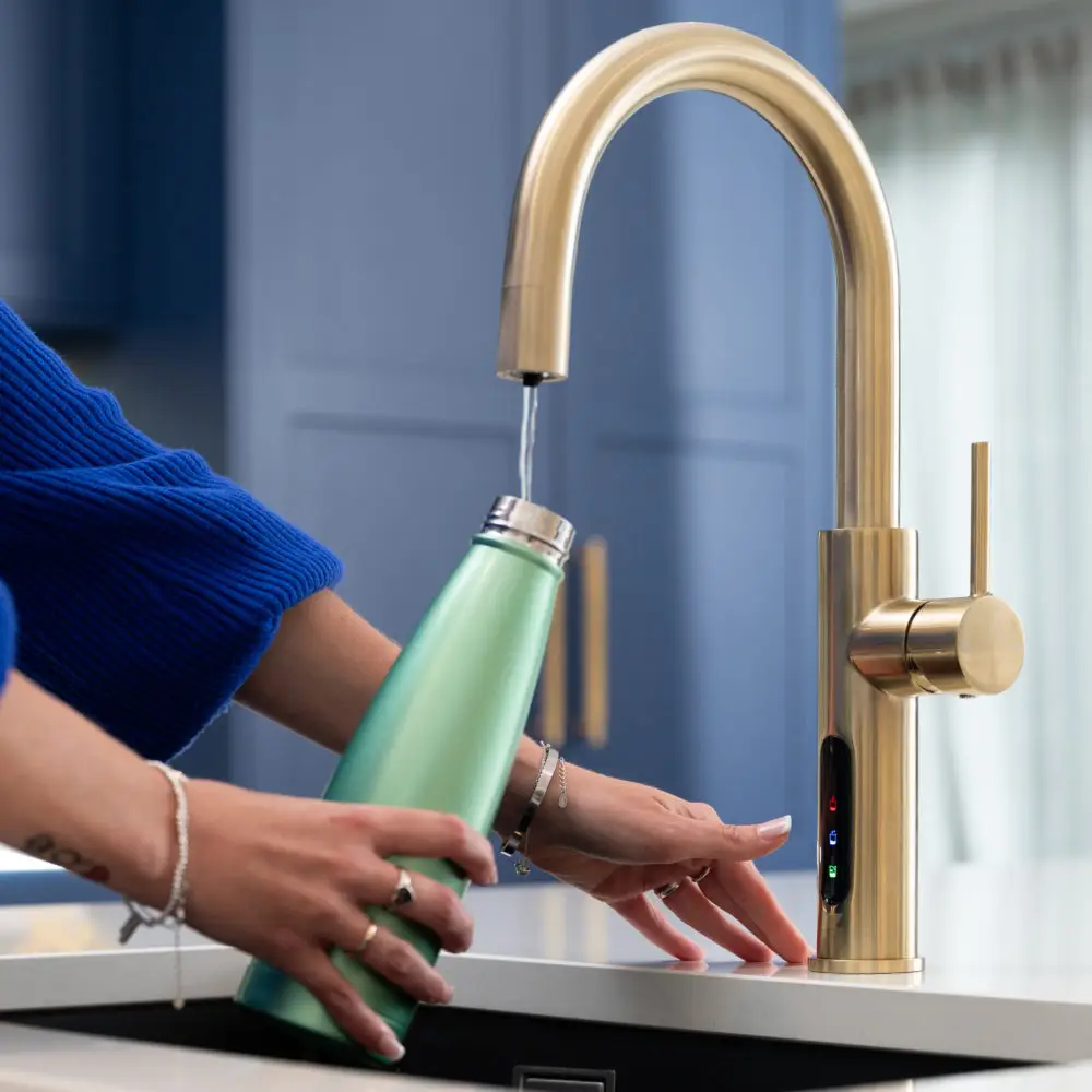 Dispensing Filtered Water Into Water Bottle From Faucet