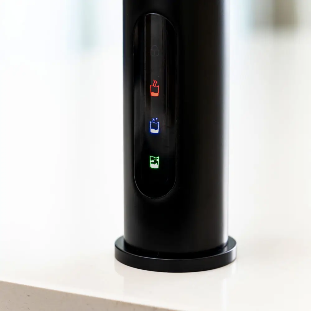 A Black Cylindrical Object With Colorful Lights