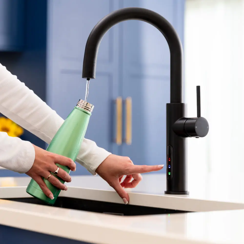 Dispensing Filtered Water Into Water Bottle From Faucet